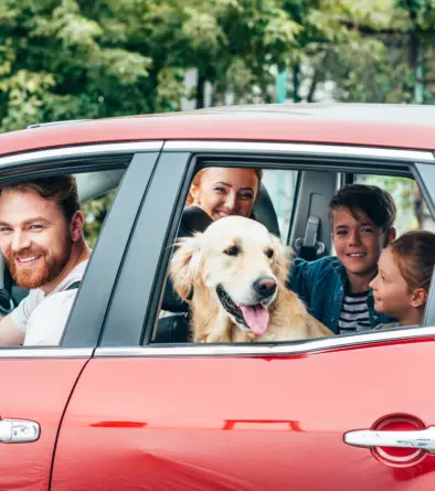Family with their golden retriever on their way to Champions Self Serve Dog Wash